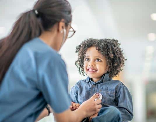 Doctor consulting child patient for cancer risk evaluation and care